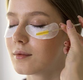 side-view-woman-wearing-eye-patches